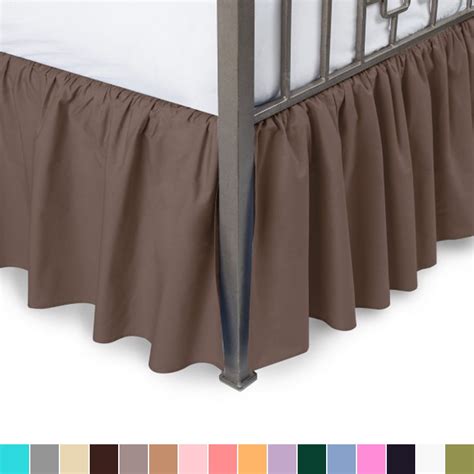 This bed skirt is. . Wrap around bed skirt with split corners